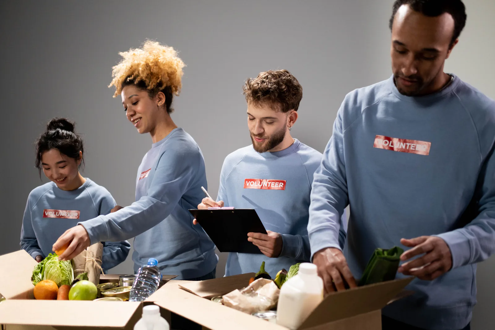 Volunteers packing food donations together